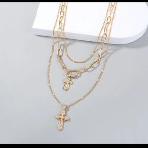 Gold tone double cross necklace